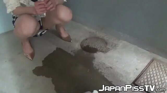 Distressed Japanese lady urinating in high heels