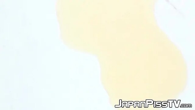 Two shy Japanese ladies pee in their panties in public