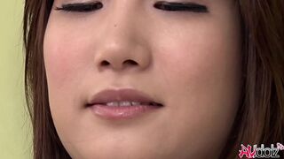 Japanese woman Mikuni Maisaki loves to tease herself on the couch with a sex toy
