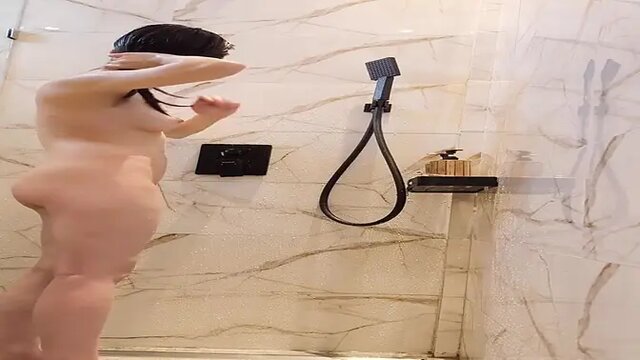 Japanese girl with black hair showers and shows off her feet